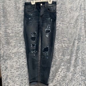 Dark distressed denim jeans